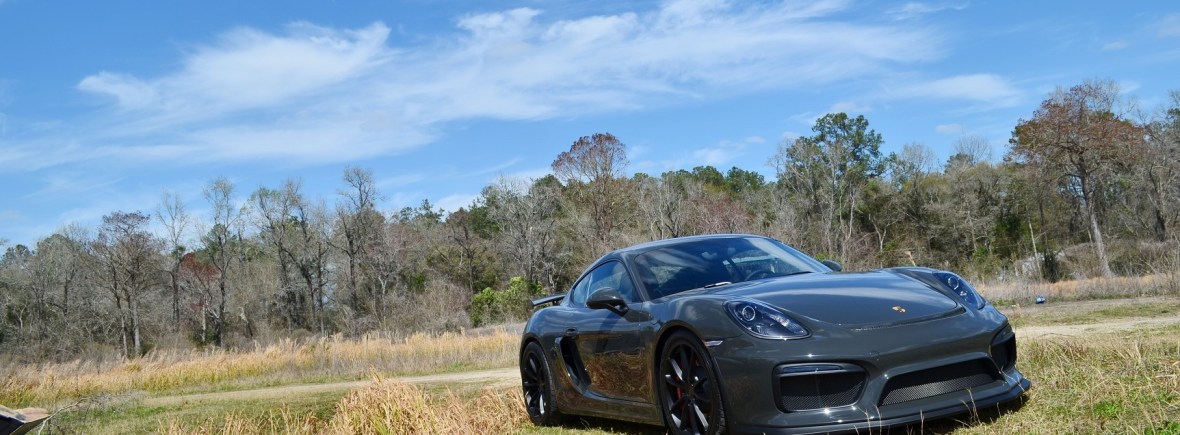 Porsche Cayman GT4 in field, Slate Grey